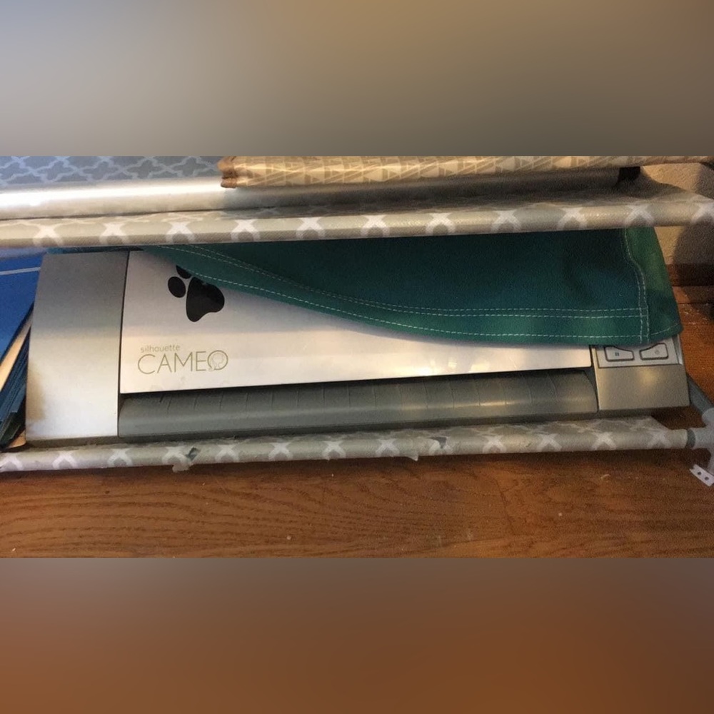 Euc silhouette cameo with cord, cover, extra blades, cutting mat, and vinyl.